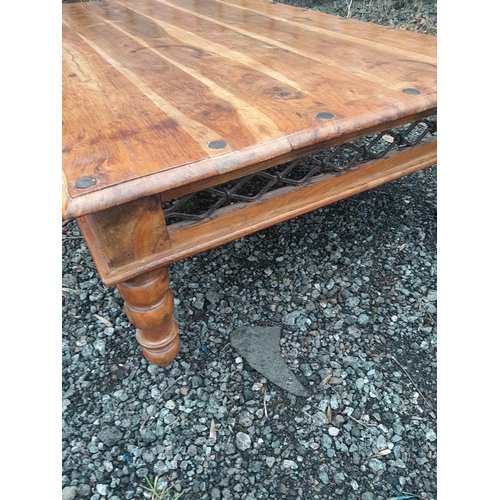 687 - Large modern hardwood low coffee table with iron frieze underneath 3ft x 4 ft approx