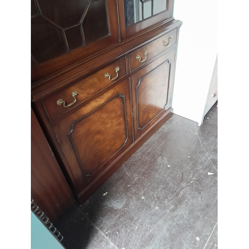 689 - 20th century mahogany veneer glazed bookshelf with cupboard under