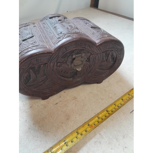 699 - Early 20th century carved camphor wood trinket box with contents