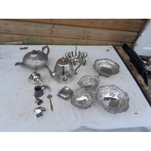 11 - Assorted silver plated and pewterware : Dansk desk weight, teapots , wine funnel toast rack etc.