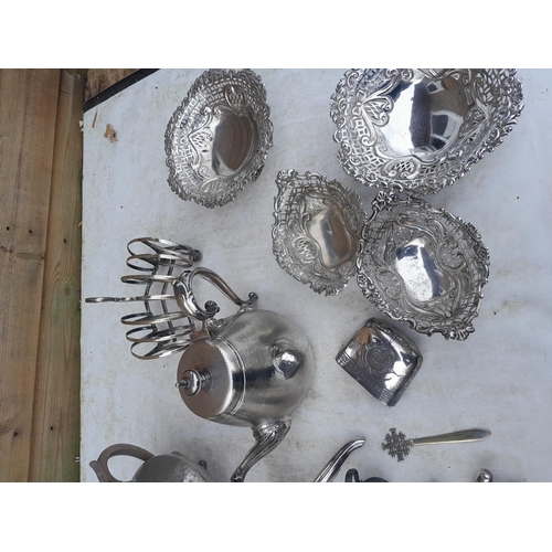 11 - Assorted silver plated and pewterware : Dansk desk weight, teapots , wine funnel toast rack etc.