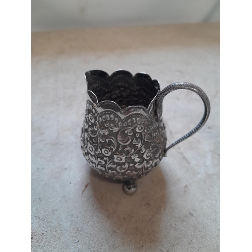 14 - South East Asian silver cream jug and teapot with floral decoration 500 g