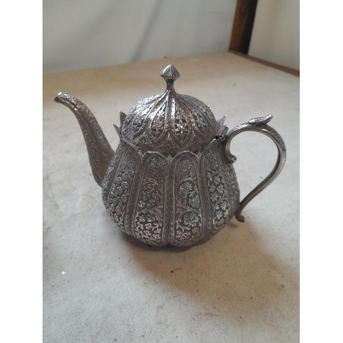 14 - South East Asian silver cream jug and teapot with floral decoration 500 g