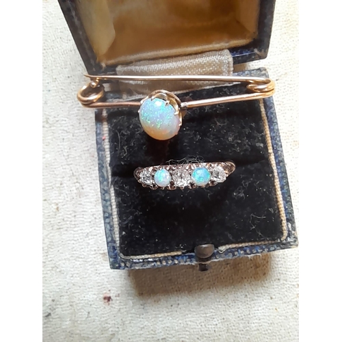 31 - 18 ct gold ring set with diamonds and opals size N with a matching bar brooch set with single opal i... 