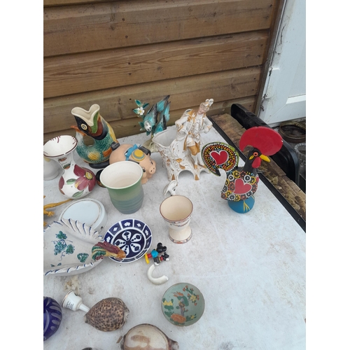 51 - Large array of glass and pottery ornaments, wooden ware, majolica Dartmouth glug jug, brass and plat... 