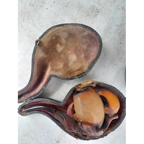 72 - Early 20th century carved meerschaum pipe modelled as a cavalier and one other and clay pipe