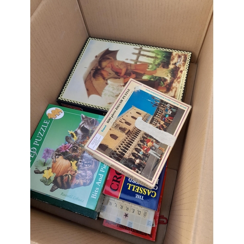 121 - Box of jigsaws