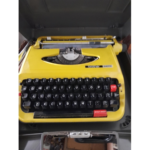 127 - Vintage yellow body Brother 440 TR typewriter in black grey case