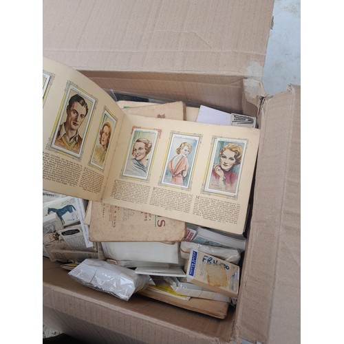 55 - Cigarette and trade cards loose in a box, reproduction cards included