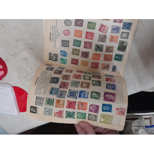 143 - Schoolboy sparsely filled World stamp album, other stamps on loose sheets mounted used, pictures etc... 