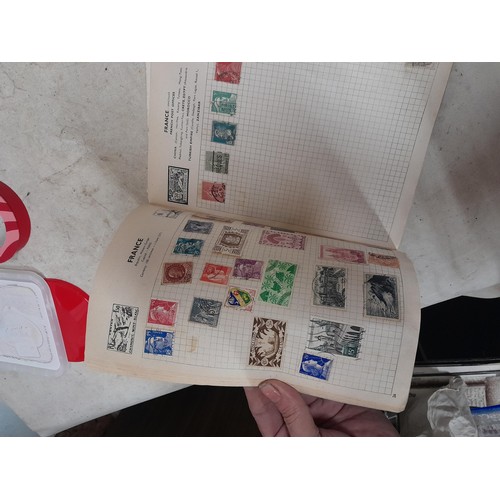 143 - Schoolboy sparsely filled World stamp album, other stamps on loose sheets mounted used, pictures etc... 