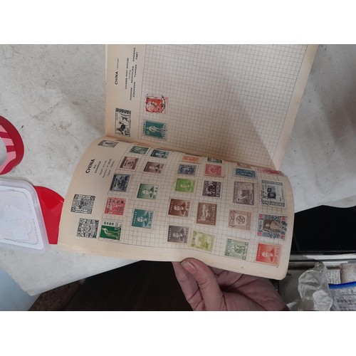 143 - Schoolboy sparsely filled World stamp album, other stamps on loose sheets mounted used, pictures etc... 