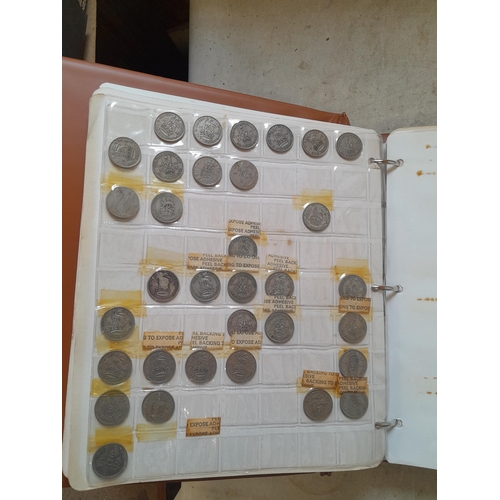 257 - Coins : mixed era One Shilling coins, mounted on album sheets