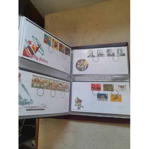 261 - Collection of Stamp First Day covers in three albums from the 1980s and Historic Vehicles coin set