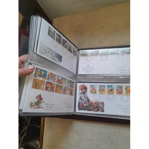 261 - Collection of Stamp First Day covers in three albums from the 1980s and Historic Vehicles coin set