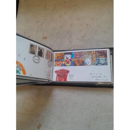 261 - Collection of Stamp First Day covers in three albums from the 1980s and Historic Vehicles coin set