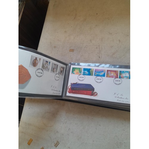 261 - Collection of Stamp First Day covers in three albums from the 1980s and Historic Vehicles coin set