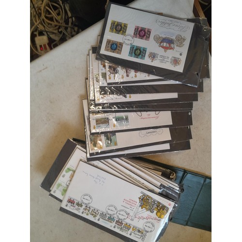 261 - Collection of Stamp First Day covers in three albums from the 1980s and Historic Vehicles coin set