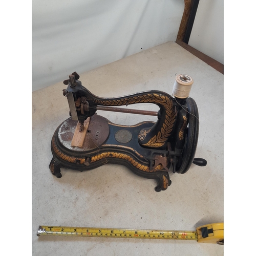 522 - 19th century Jones Swan neck sewing machine, gilding pretty good note some surface oxidization