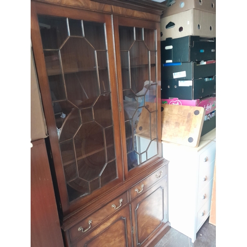 675 - 20th century mahogany veneer glazed bookshelf with cupboard under