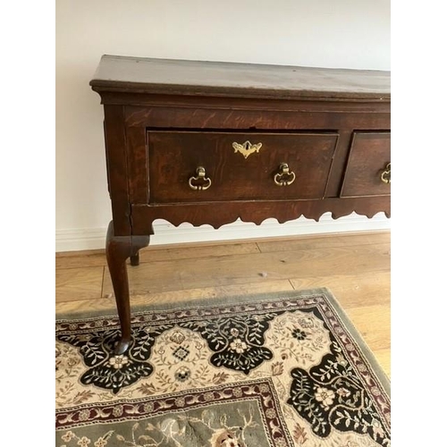 11 - Georgian oak dresser base with three drawers on cabriole legs 50 cms x 170 cms long x 80 cms high