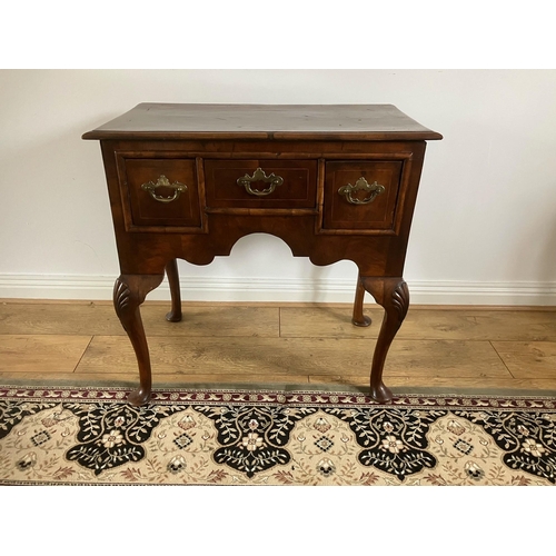 12 - George II walnut veneered lowboy with crossbanding and boxwood stringing on cabriole legs with shell... 