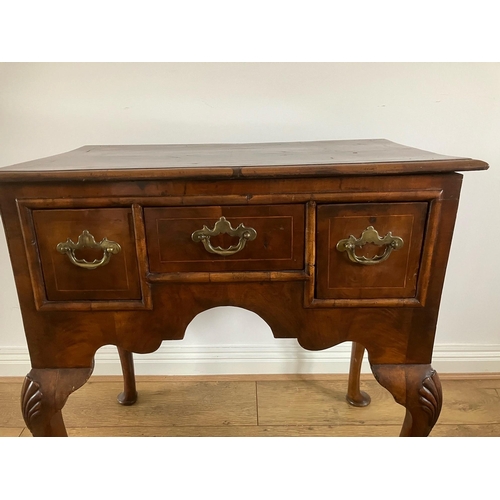 12 - George II walnut veneered lowboy with crossbanding and boxwood stringing on cabriole legs with shell... 