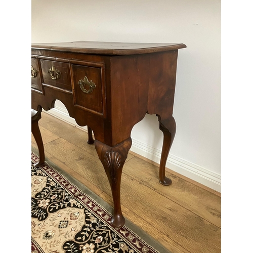 12 - George II walnut veneered lowboy with crossbanding and boxwood stringing on cabriole legs with shell... 