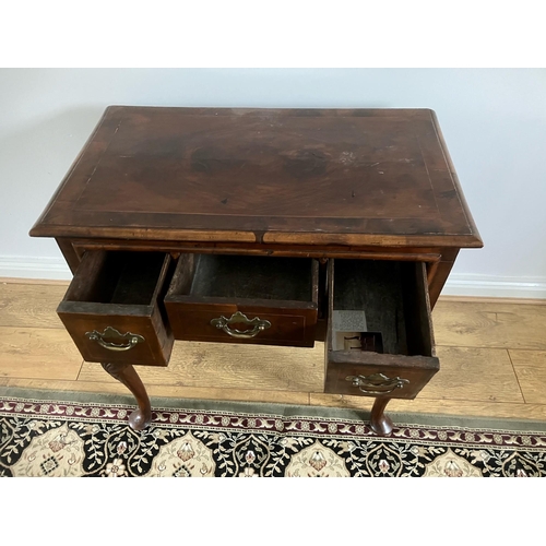 12 - George II walnut veneered lowboy with crossbanding and boxwood stringing on cabriole legs with shell... 