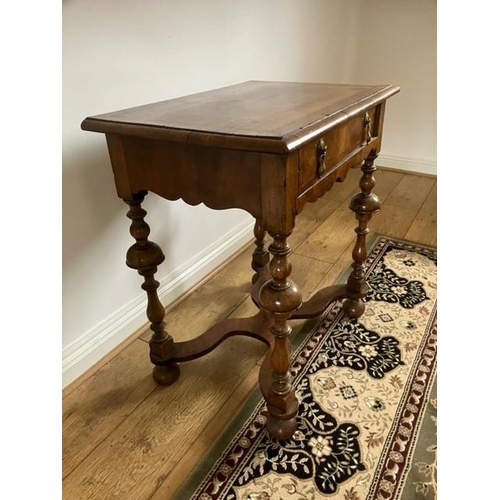 13 - 18th century style walnut  single drawer table with quarter veneer top, carved apron, turned legs wa... 