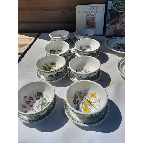 11 - Assorted pieces of Portmeirion Botanicals pottery : plates , soup bowls on saucers , plastic tray et... 