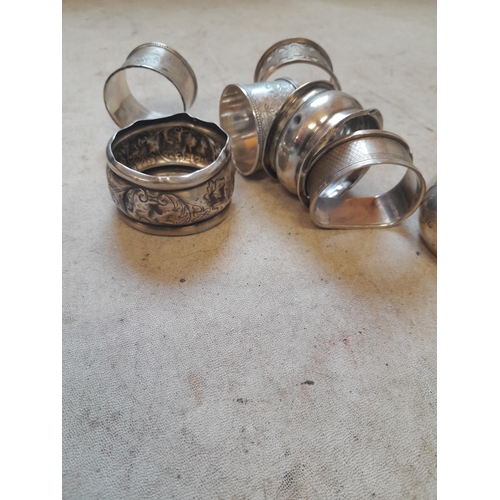 30 - A cluster of silver serviette rings, various assay offices, dates , makers and condition 120 g