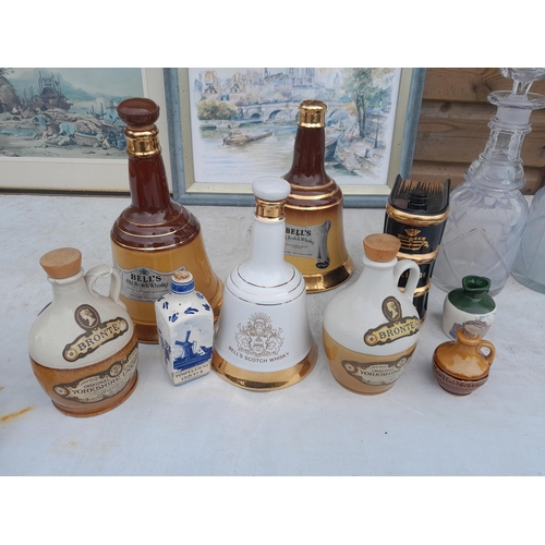 61 - Array of assorted pottery and glass decanters, desk stand, various pictures framed and good roll of ... 