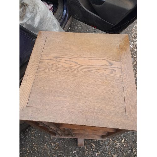 210 - Early 20th century oak revolving bookcase, note splitting