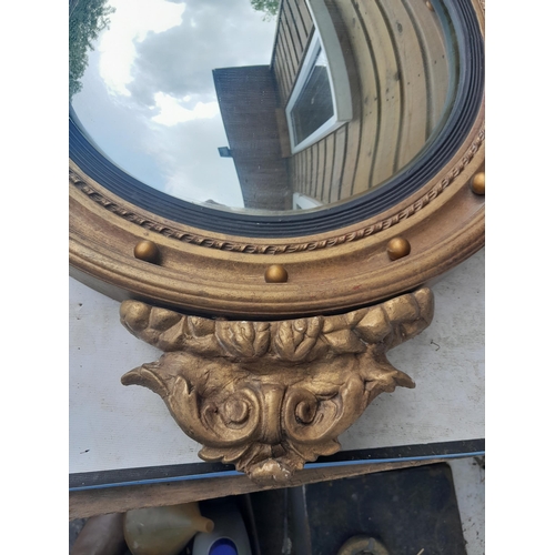 25 - Early 20th century gilt convex wall mirror with plaster eagle pediment