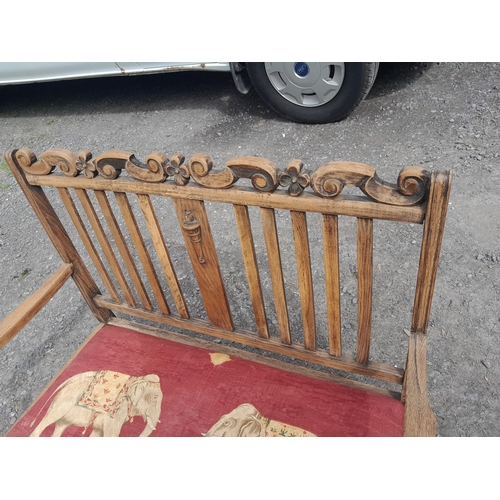 26 - Early 20th century oak settle with later upholstery, note wobble to arm, therefore light reglue and ... 