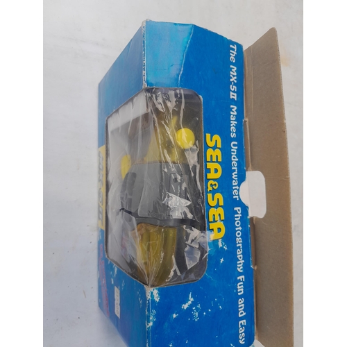 63 - Boxed Sun & Sea MX 5 II underwater camera, spinning top and toiletries