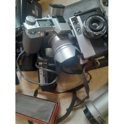 299 - Assorted cameras and accessories, handi cam etc.