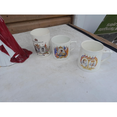 57 - Assorted commemorative ware including Royal Worcester QEII figure and mugs