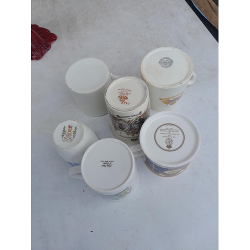 57 - Assorted commemorative ware including Royal Worcester QEII figure and mugs