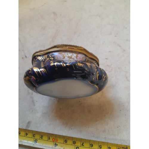 87 - Early 20th century Continental porcelain trinket box with gilded metal interior