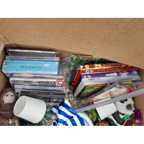 95 - Box of assorted modern household items : CED DVDS, books, tin sign, Westclox wall clock etc.