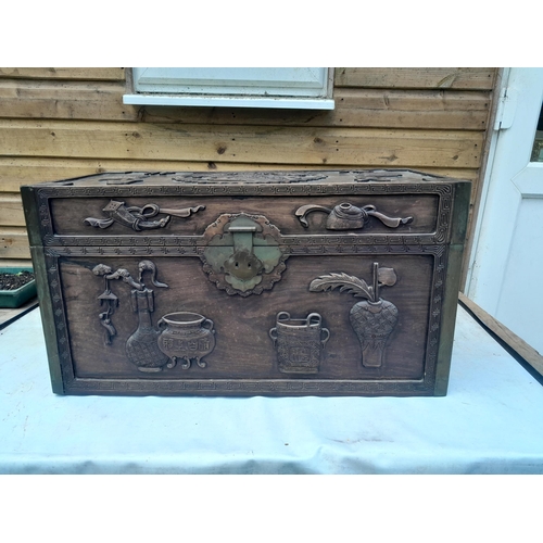 114 - 19th century Chinese hardwood travelling trunk with carved decoration, mythical animals and charms, ... 