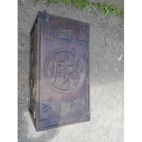 114 - 19th century Chinese hardwood travelling trunk with carved decoration, mythical animals and charms, ... 