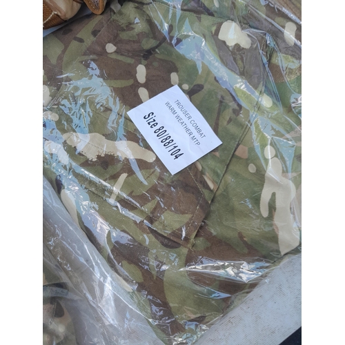 126 - Mainly New Old Stock : Army surplus fatigues, jackets, combats, pouches etc.