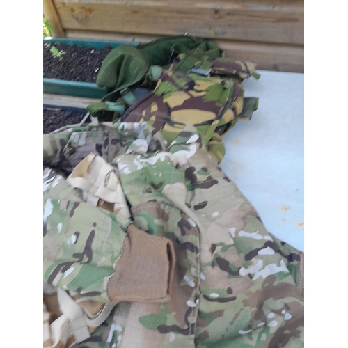 126 - Mainly New Old Stock : Army surplus fatigues, jackets, combats, pouches etc.