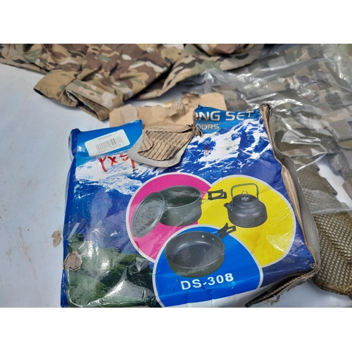 169 - Some New Old Stock : army fatigues, camping items, 2 x saws