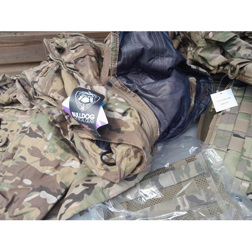 169 - Some New Old Stock : army fatigues, camping items, 2 x saws