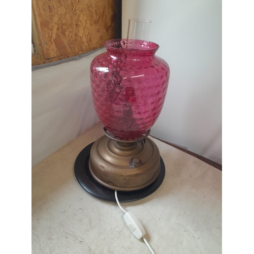 317 - Victorian paraffin lamp converted to electric with cranberry colour shade