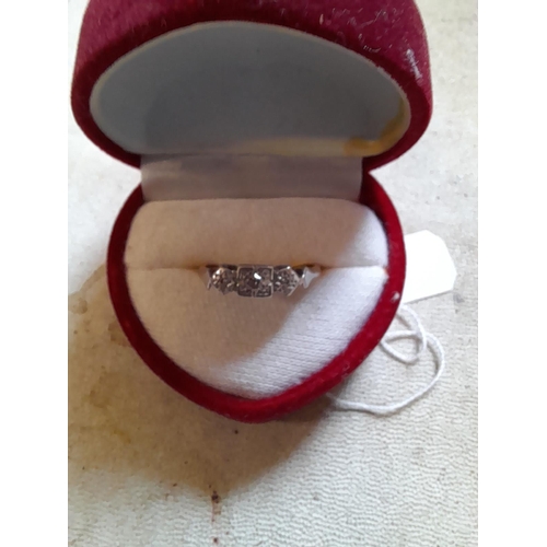 405 - 18 ct gold and platinum ring set with three diamonds in a presentation box size M-N, 2.3 g